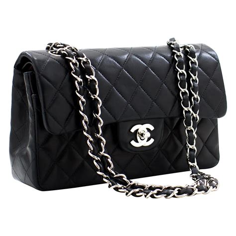 women's black chanel bag|Black Chanel bag with black chain.